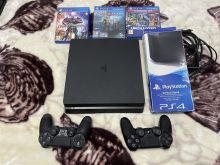 PS4 Slim 1 terabyte me dy leva dhe super lojra 