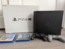 PS4 PRO 1TB WITH 2 CONTROLLERS AND 5 GAMES